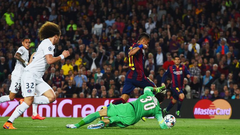 BARCELONA, SPAIN - APRIL 21:  Neymar of Barcelona beats goalkeeper Salvatore Sirigu of PSG as he scores their first goal during the UEFA Champions League Q