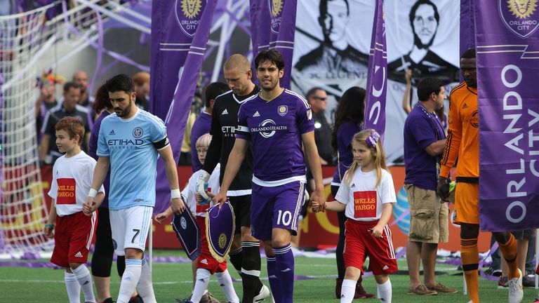 David Villa of New York City FC and Kaka of Orlando City SC walk out for introductions prior to an MLS soccer match in March 2015