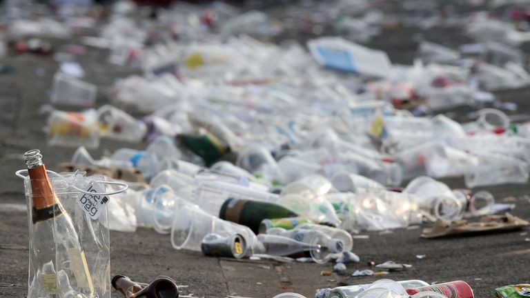 Wine bottles and plastic cups are left behind during Ladies Day of the Crabbies Grand National Festival