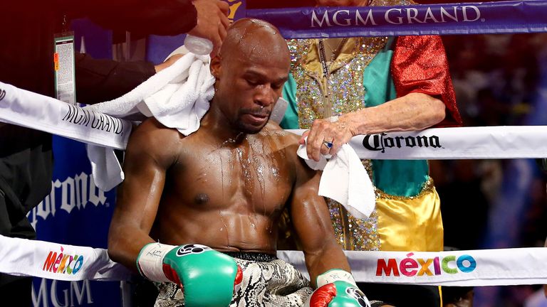 Floyd Mayweather Jr. sits in corner during a break between rounds while taking on Marcos Maidana during their WBC/WBA welterweight bout