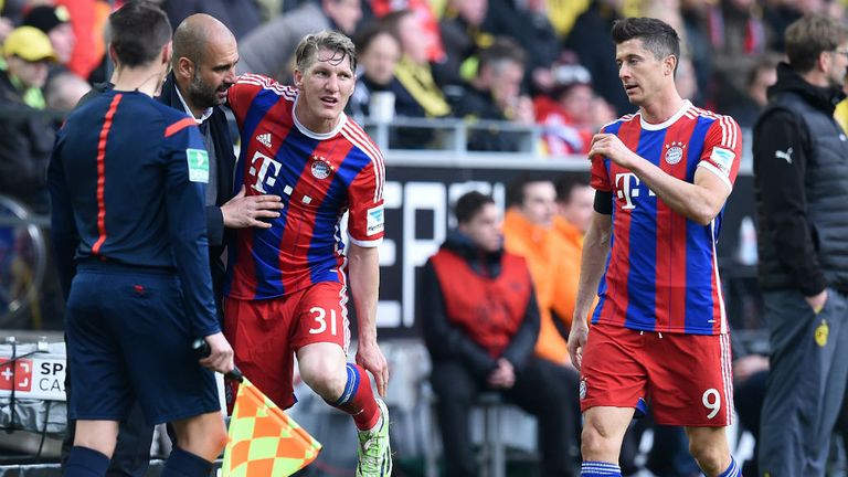 Bastian Schweinsteiger shows his injury to Bayern Munich head coach Pep Guardiola