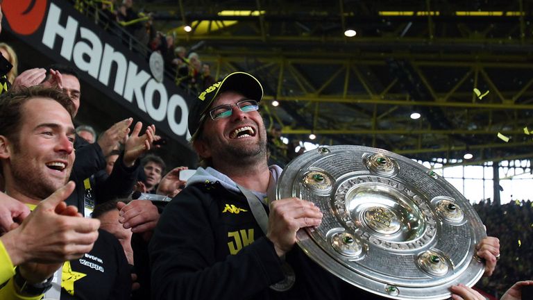 Juergen Klopp, head coach of Dortmund lifts the trophy after winning the german title on May 5, 2012