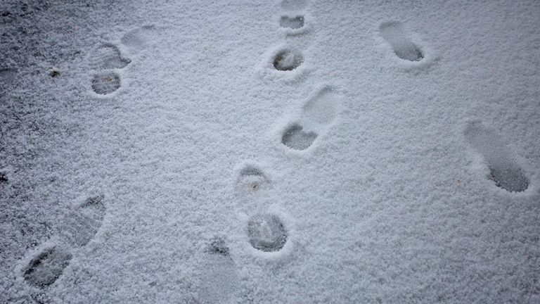 Racegoers footprints after a heavy hailstorm