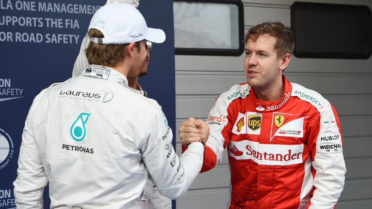 Nico Rosberg shakes hands with Sebastian Vettel