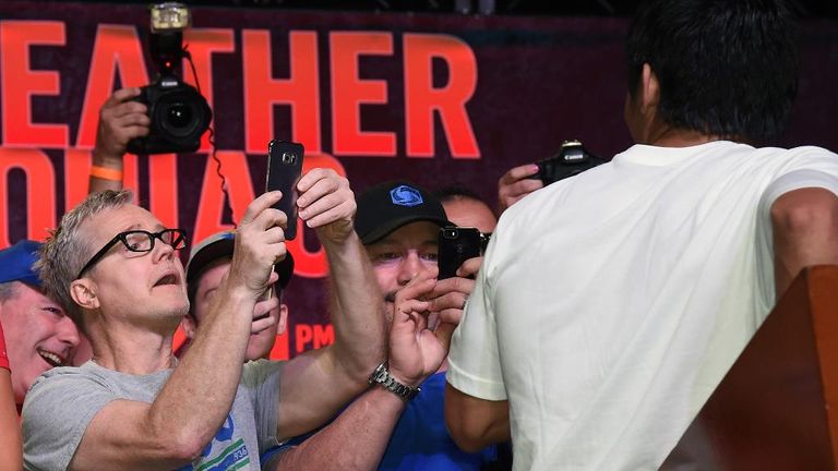 Freddie Roach and WBO welterweight champion Manny Pacquiao during a fan rally at the Mandalay Bay Convention Center on April 28, 2015 in Las Vegas