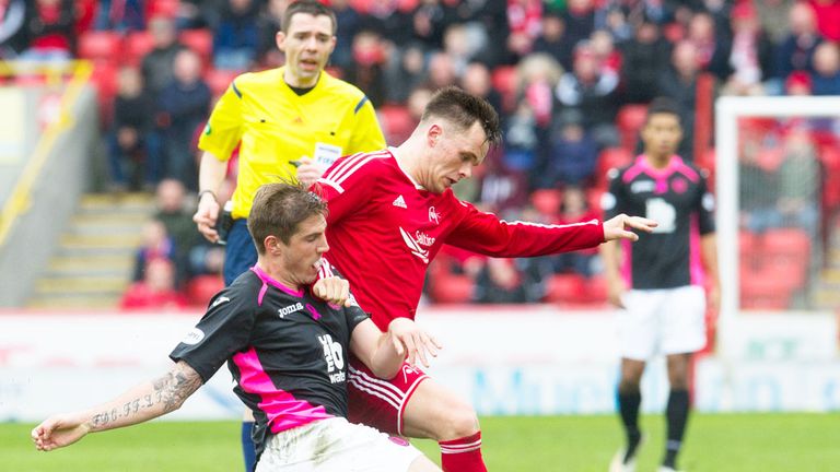 Partick's Frederic Frans tackles Lawrence Shankland of Aberdeen