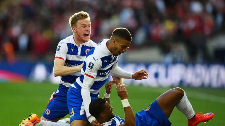 Garath McCleary of Reading (front) is mobbed by team-mates Michael Hector (middle) and Alex Pearce after he levelled the score 1-1