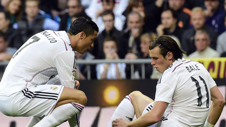 Gareth Bale tells Cristiano Ronaldo of his injury early in the game against Malaga