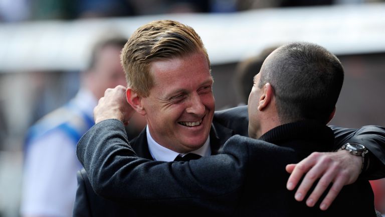 SWANSEA, WALES - APRIL 11:  Everton manager Roberto Martinez (r) and Swansea manager Garry Monk embrace  before the Barclays Premier League match between S
