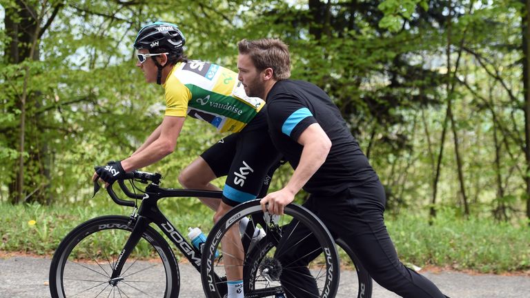 Geraint Thomas makes a wheel-change on stage two of the 2015 Tour de Romandie