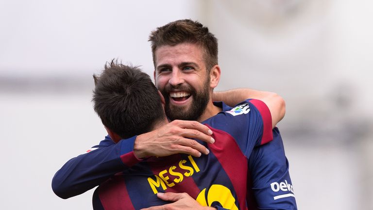 Barcelona's Argentinian forward Lionel Messi (L) celebrates with teammate Barcelona's defender Gerard Pique after scoring during the Spanish league footbal