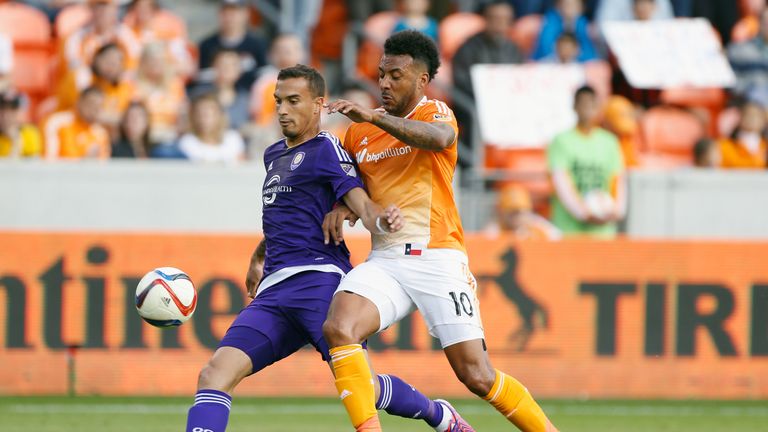 Giles Barnes of Houston Dynamo battles for the ball with Seb Hines of Orlando City SC during their game in Houston, March 2015