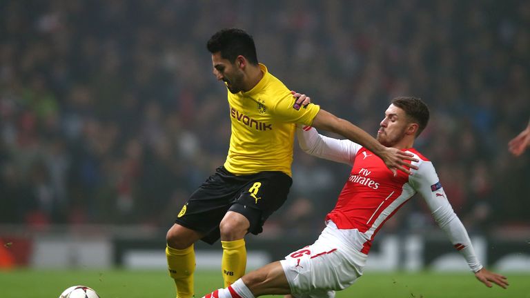 Gundogan in action with Arsenal's Aaron Ramsey during a Champions League clash