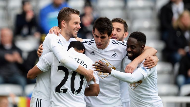 Gylfi Sigurosson of Swansea City celebrates scoring the second goal against Newcastle