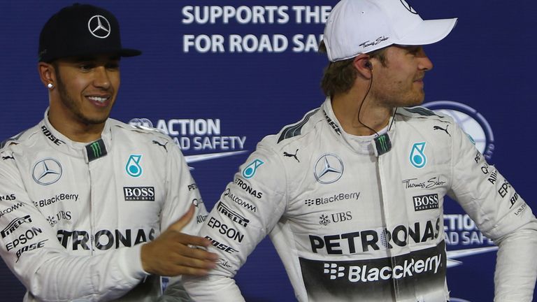 Lewis Hamilton tries to shake hands with his teammate German driver Nico Rosberg 