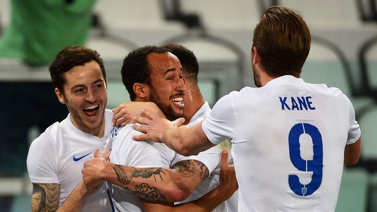 Andros Townsend of England celebrates scoring their first goal with Ryan Mason, Harry Kane and Kyle Walker of England.