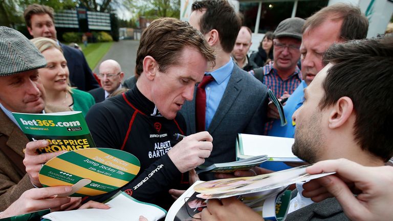Jockey Tony McCoy signs racecards during the bet365 Jump Finale at Sandown Racecourse, Surrey. PRESS ASSOCIATION Photo. Picture date: Saturday April 25, 20