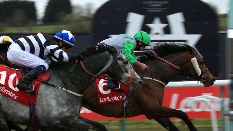Grey Mirage, (right) ridden by Ryan Moore comes home to win The Ladbrokes All-Weather Mile Championships Conditions Stakes during the All-Weather Champions