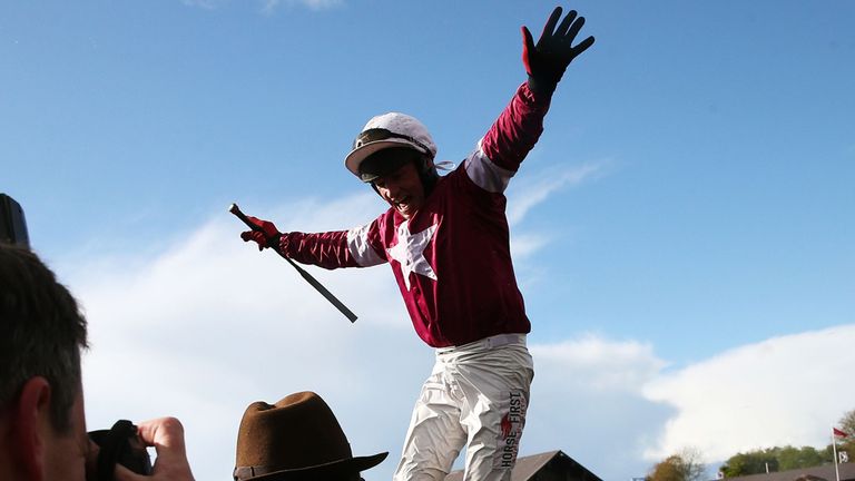 Paul Carberry celebrates winning the Bibby Financial Services Ireland Punchestown Gold Cup on Don Cossack during the Bibby Financial Services Ireland Punch