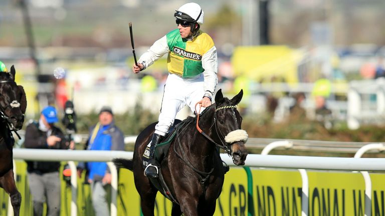 Jockey Leighton Aspell celebrates on board Many Clouds after victory in the Crabbie's Grand National Chase during Grand National Day of the Crabbies Grand 