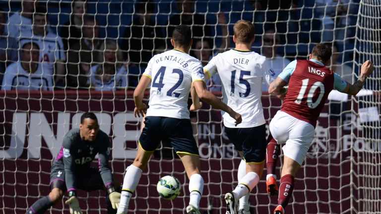 Danny Ings (R) has an early shot straight at Tottenham Hotspur's Dutch goalkeeper Michel Vorm (L) who saves the attempt.