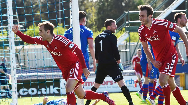 Aberdeen's Niall McGinn (left) wheels away in celebration having hammered the ball home to put his side ahead