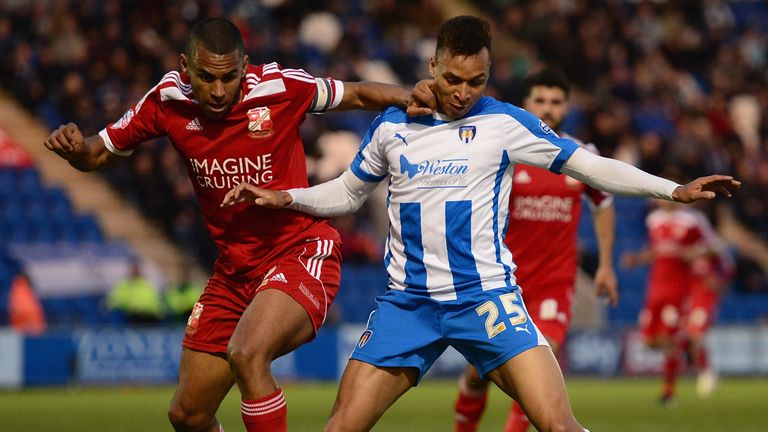 COLCHESTER, ENGLAND - APRIL 28:  Jacob Murphy of Colchester United battles with Nathan Thompson of Swindon Town during the Sky Bet League One match between