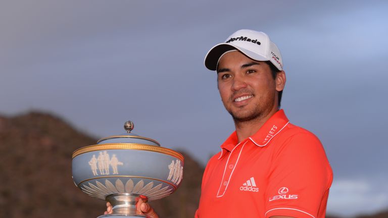 Jason Day of Australia poses with the Walter Hagen Cup after defeating Victor Dubuisson of France on the 23rd hole.