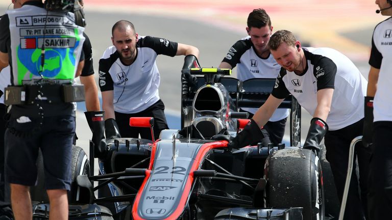 Jenson Button's stricken MP4-30 is retrieved in Bahrain