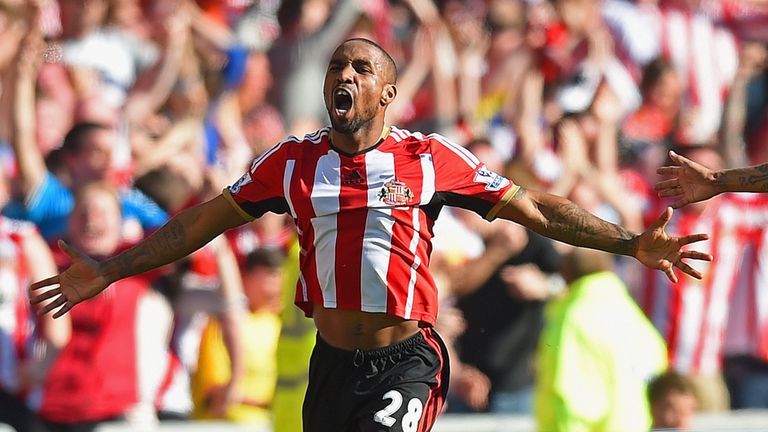 Jermain Defoe celebrates after scoring the opening goal against Newcastle