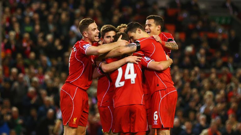 Joe Allen celebrates with Liverpool team-mates