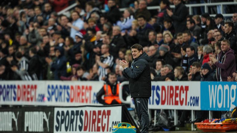 Newcastle coach John Carver stands on the sideline against Manchester United at St.James' Park on March 4