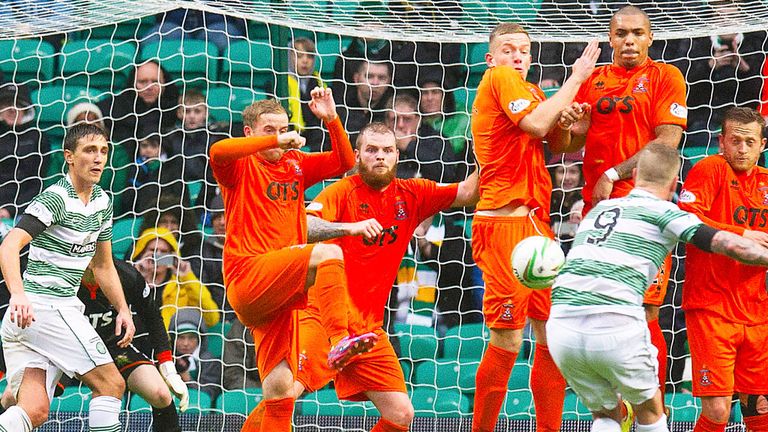 Celtic striker John Guidetti scores with a free-kick against Kilmarnock last October