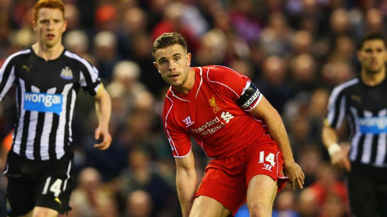 LIVERPOOL, ENGLAND - APRIL 13:  Jordan Henderson of Liverpool is watched by Jack Colback of Newcastle United during the Barclays Premier League match betwe