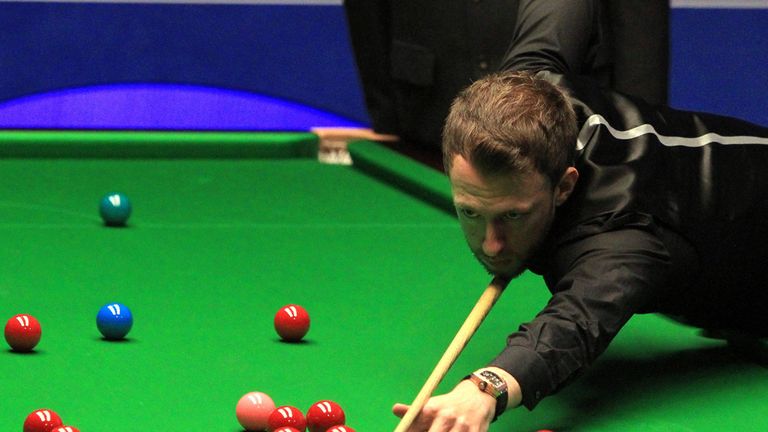 Judd Trump in action against Stuart Carrington during day six of the Betfred World Championships at the Crucible Theatre, Sheffield.