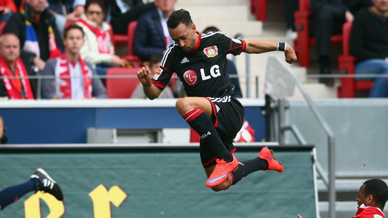 MAINZ, GERMANY - APRIL 11: Karim Bellarabi of Leverkusen outjumps Junior Diaz of Mainz during the Bundesliga 