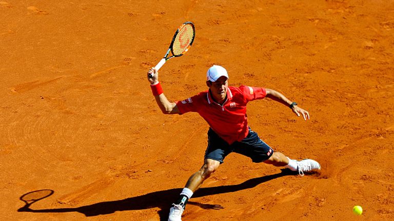 Kei Nishikori of Japan in action against Santiago Giraldo of Colombia during day four of the Barcelona Open 