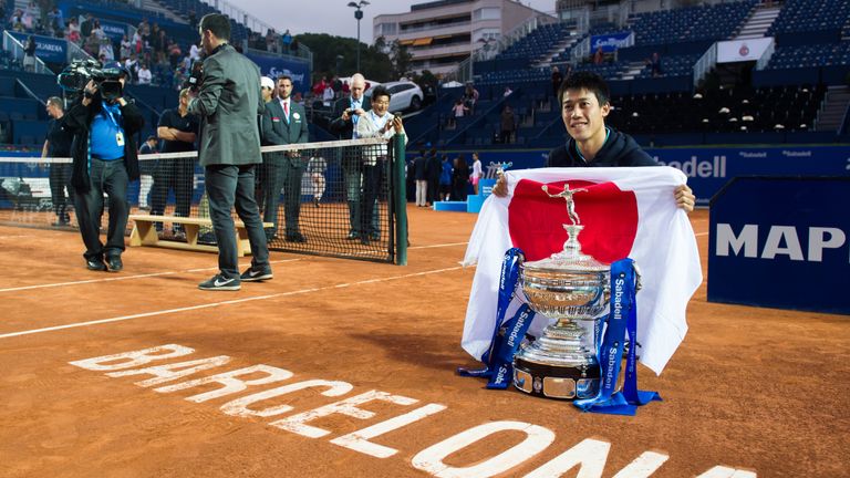  Kei Nishikori of Japan poses with the trophy of the Barcelona Open Banc Sabadell after defeating Pablo Andujar of Spain 