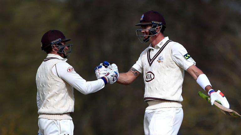 OXFORD, ENGLAND - APRIL 12: Kevin Pietersen of Surrey celebrates his century with team mate Gary Wilson during day one of the friendly match between Oxford