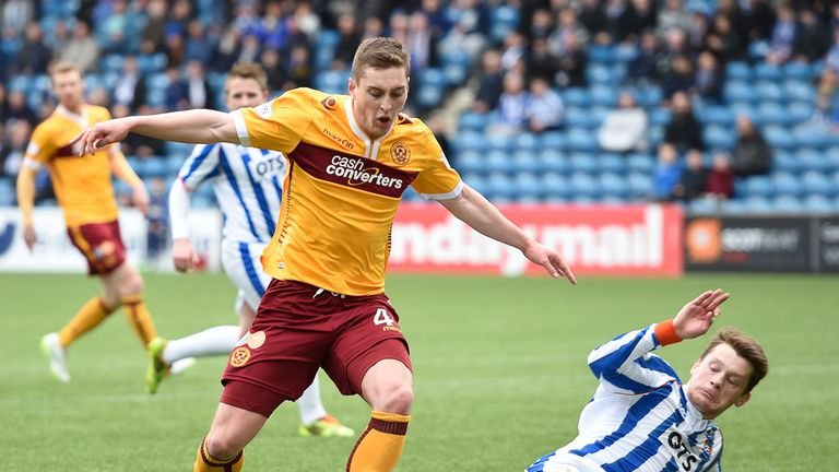 Ross Barbour tackles Conor Grant as Motherwell have a penalty claim turned down 