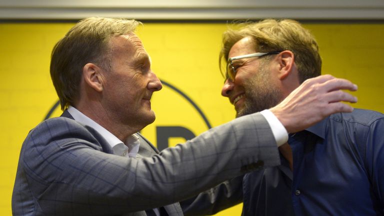 Jurgen Klopp (right) is hugged by Dortmund's CEO Hans-Joachim Watzke