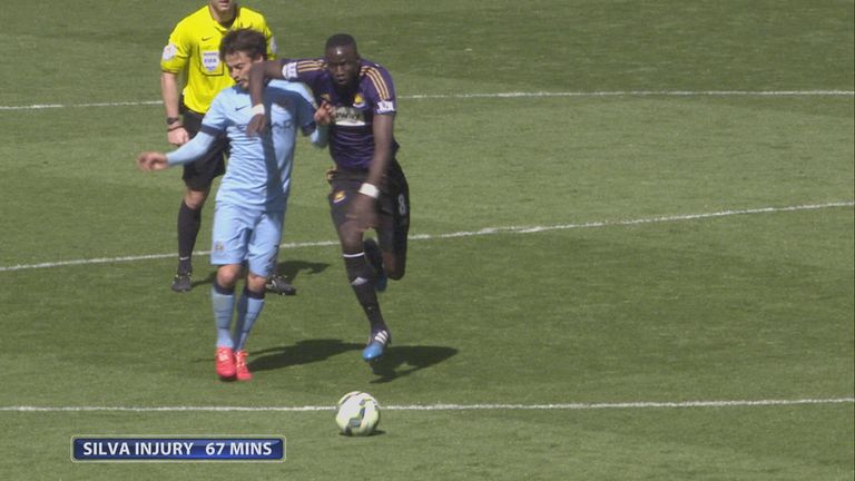 Silva was stretchered off after being caught by Kouyate's elbow