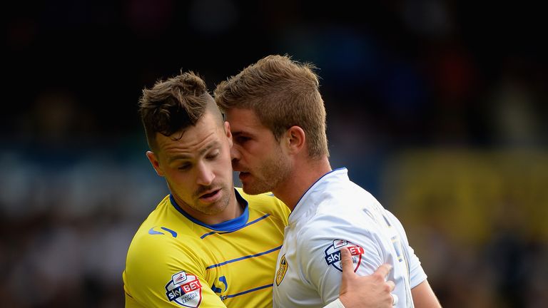 LEEDS, ENGLAND - OCTOBER 04: Gaetano Berardi of Leeds United confronts Chris Maguire of Sheffield Wednesday during the Sky Bet Championship match between L
