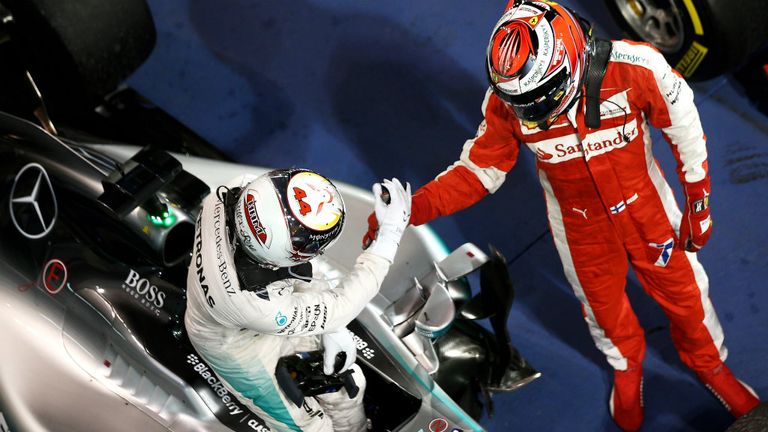 Lewis Hamilton and Kimi Raikkonen congratulate each other in parc ferme