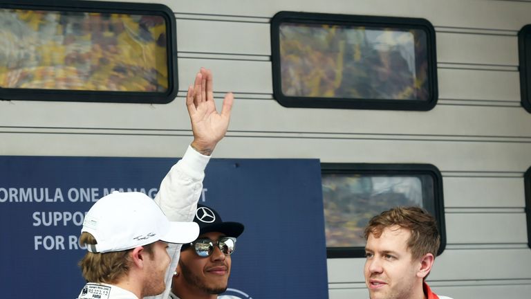 Nico Rosberg and Sebastian Vettel shake hands