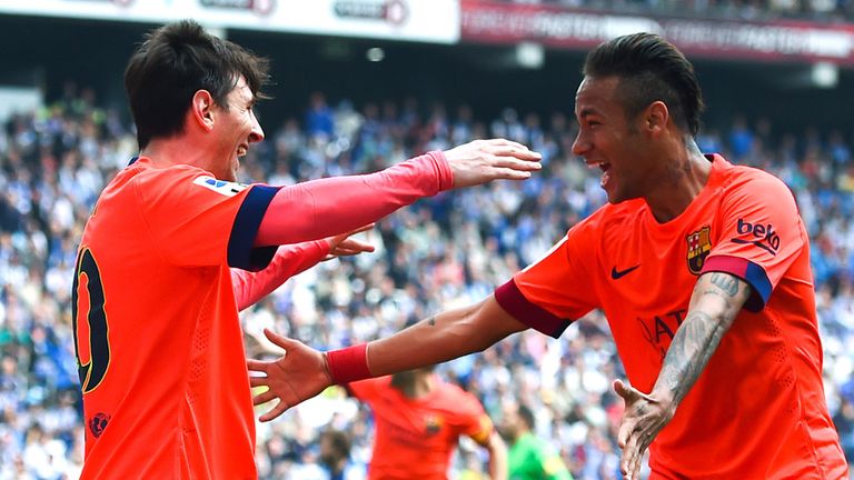 Lionel Messi of FC Barcelona celebrates with his team mate Neymar