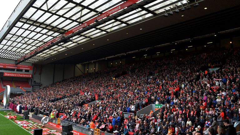Supporters sit on The Kop during a memorial service at Anfield  on the 26th anniversary of the Hillsborough Disaster