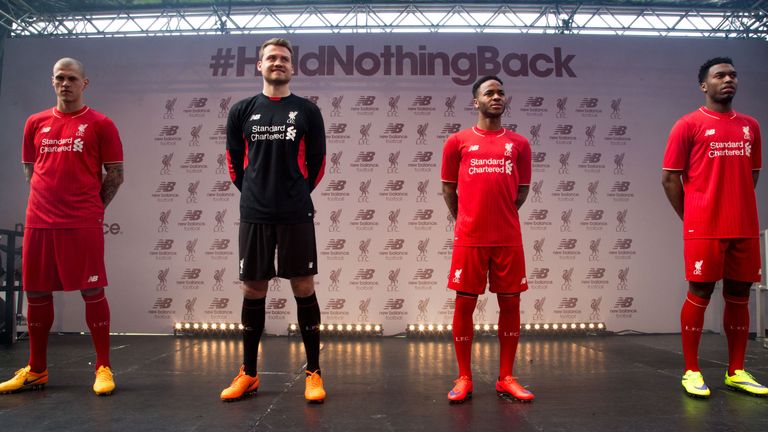 Liverpool's Martin Skrtel, Simon Mignolet, Raheem Sterling and Daniel Sturridge model the new home kit at Anfield