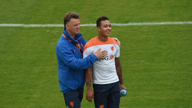 Louis van Gaal shares a light moment with Netherlands forward Memphis Depay during a training session  in Rio de Janeiro during the 2014 FIFA World Cup