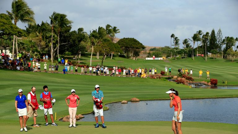 Michelle Wie reacts on the 18th green after winning the LPGA LOTTE Championship.